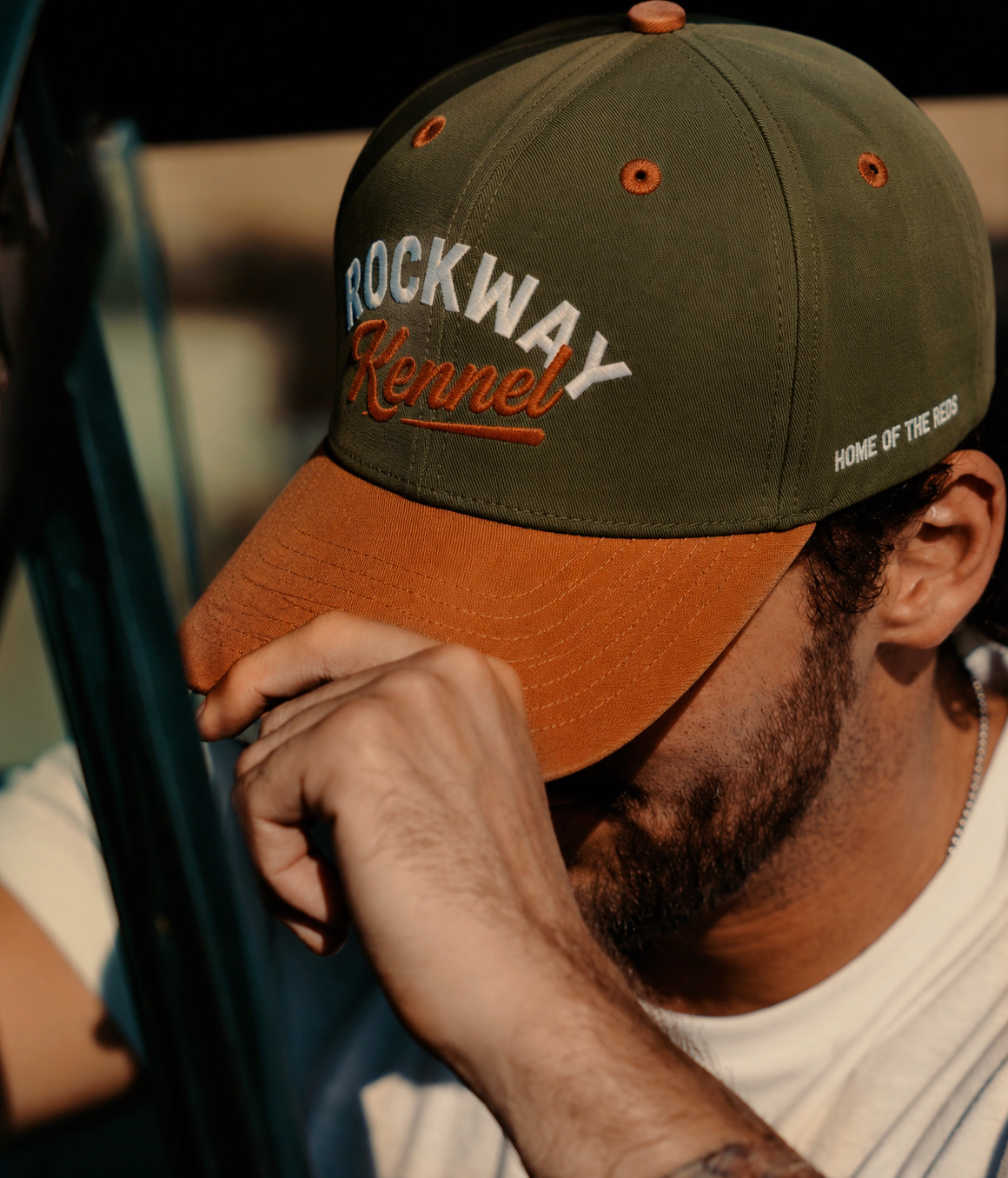 Rockway Kennel cap worn in warm evening light